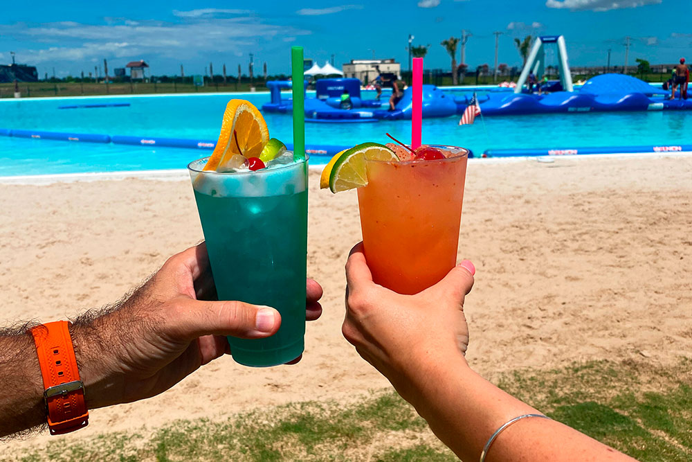 Two Guests Toast Cocktails